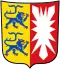 Wappen von Schleswig-Holstein mit zwei blauen Löwen auf gelbem Grund links und weißem Nesselblatt auf rotem Grund rechts.